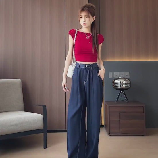 YEEYEEWang Wide-Leg jeans video: Asian model in Denim Blue walks and poses, camera pans down to high waist, white topstitched pockets and wide drape, lifts leg showing floor-length cuffed hem