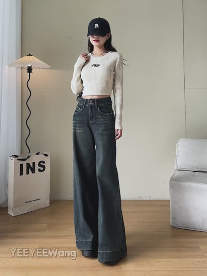 YEEYEEWang Wide-Leg jeans video Fleece-Lined in Mid-Wash Blue: Asian model walks showing drapey fit, zooms to high waist and cuffed hem, lifts leg to reveal thick fleece lining, stroking it.