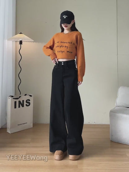 YEEYEEWang Wide-Leg jeans video in Solid Black: Asian model walks showing drapey wide-leg fit, camera zooms to double-button high waist and cuffed hems as she lifts the leg to show details.